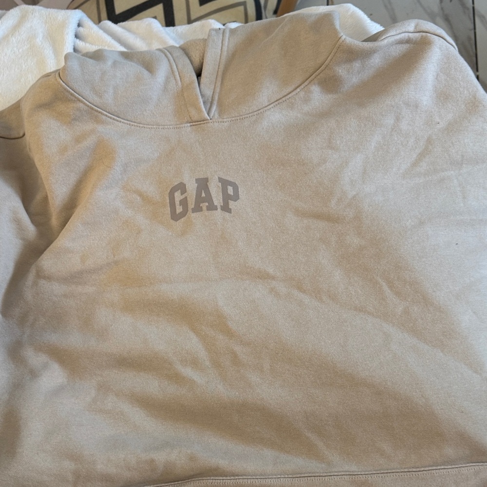 Neutral colored GAP sweater with gap writing on the back. Oversized